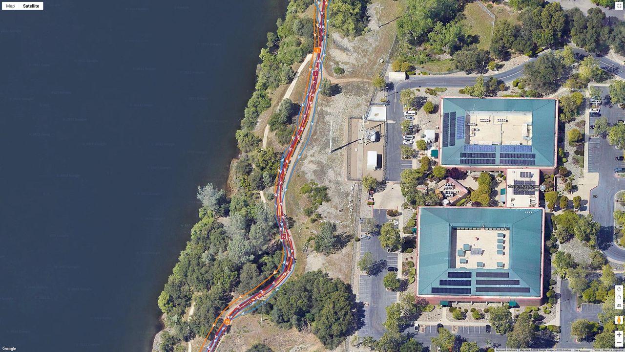 A GPS map showing how the Garmin Fenix 8 (red line), COROS PACE Pro (orange), and Google Pixel Watch 3 (blue) compare for location accuracy during a 20-mile run.