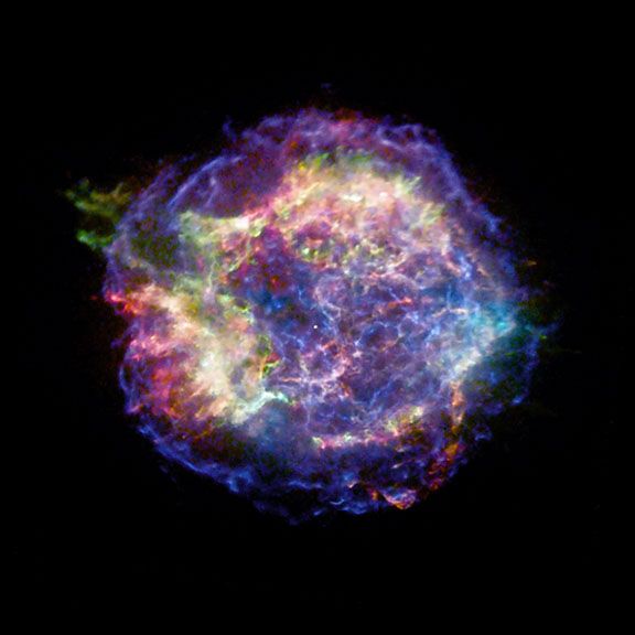 Chandra X-ray Observatory image of the supernova remnant Cassiopeia A. The red, green, and blue regions in this X-ray image of Cas A show where the intensity of low, medium, and high-energy X-rays, respectively, is greatest. While this photo shows the rem