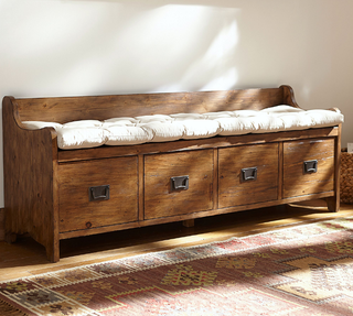 Large wooden entryway storage bench.