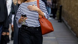 woman in stripe top and jeans