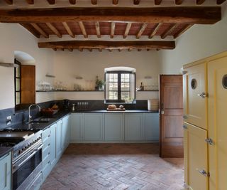 Tuscan kitchen with blue cabinets