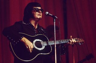 Roy Orbison playing the guitar