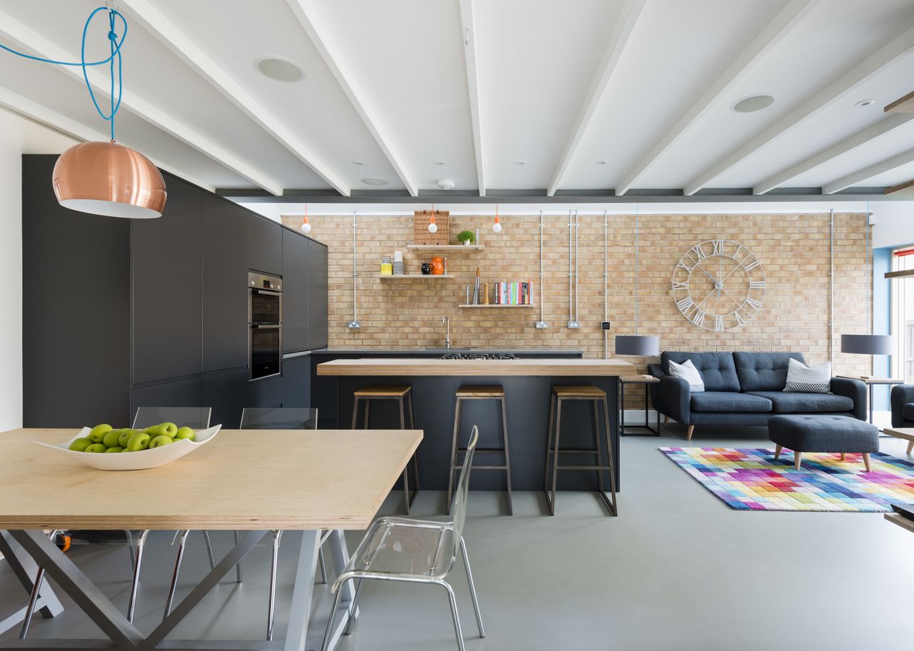 interior of self build home with brick and black kitchen