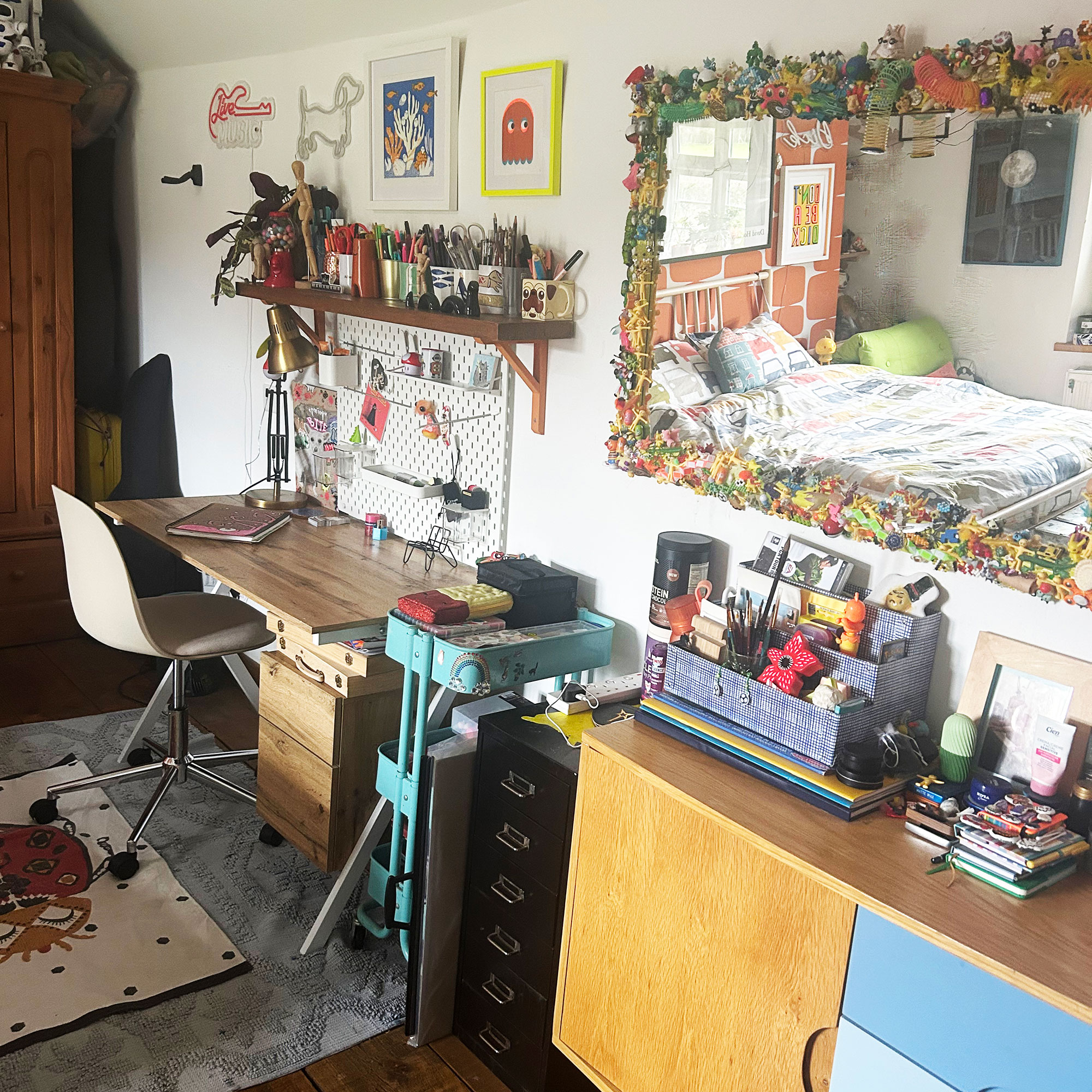 Teenage boy bedroom with desk area, decorative mirror and artwork