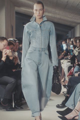 Alaia Fall 2023 runway, model wearing barrel jeans