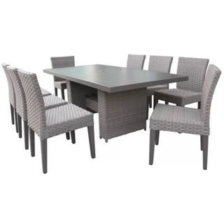 A gray Merlyn Rectangular 8-Person Outdoor Dining Set on a white background
