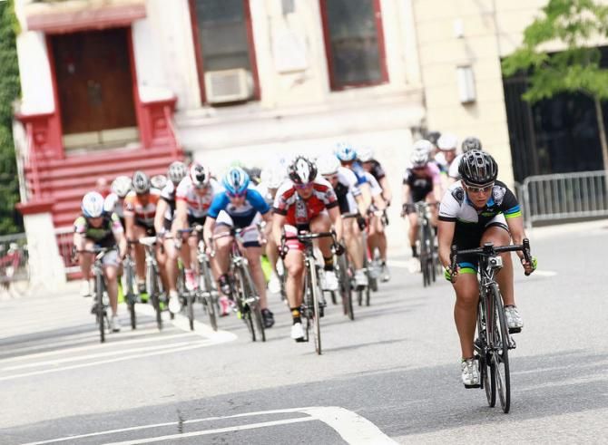 Stephanie Kaplan (CRCA/Asphalt Green Cycling Team) takes a flyer to help as well.