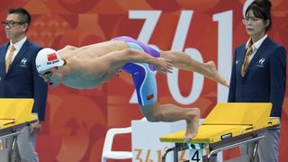 Team China swimmer Pan Zhanle diving into the pool at Asian Games 2026