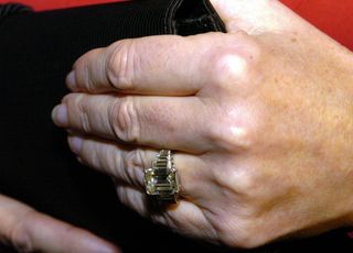 Queen camilla's hand showing her diamond engagement ring