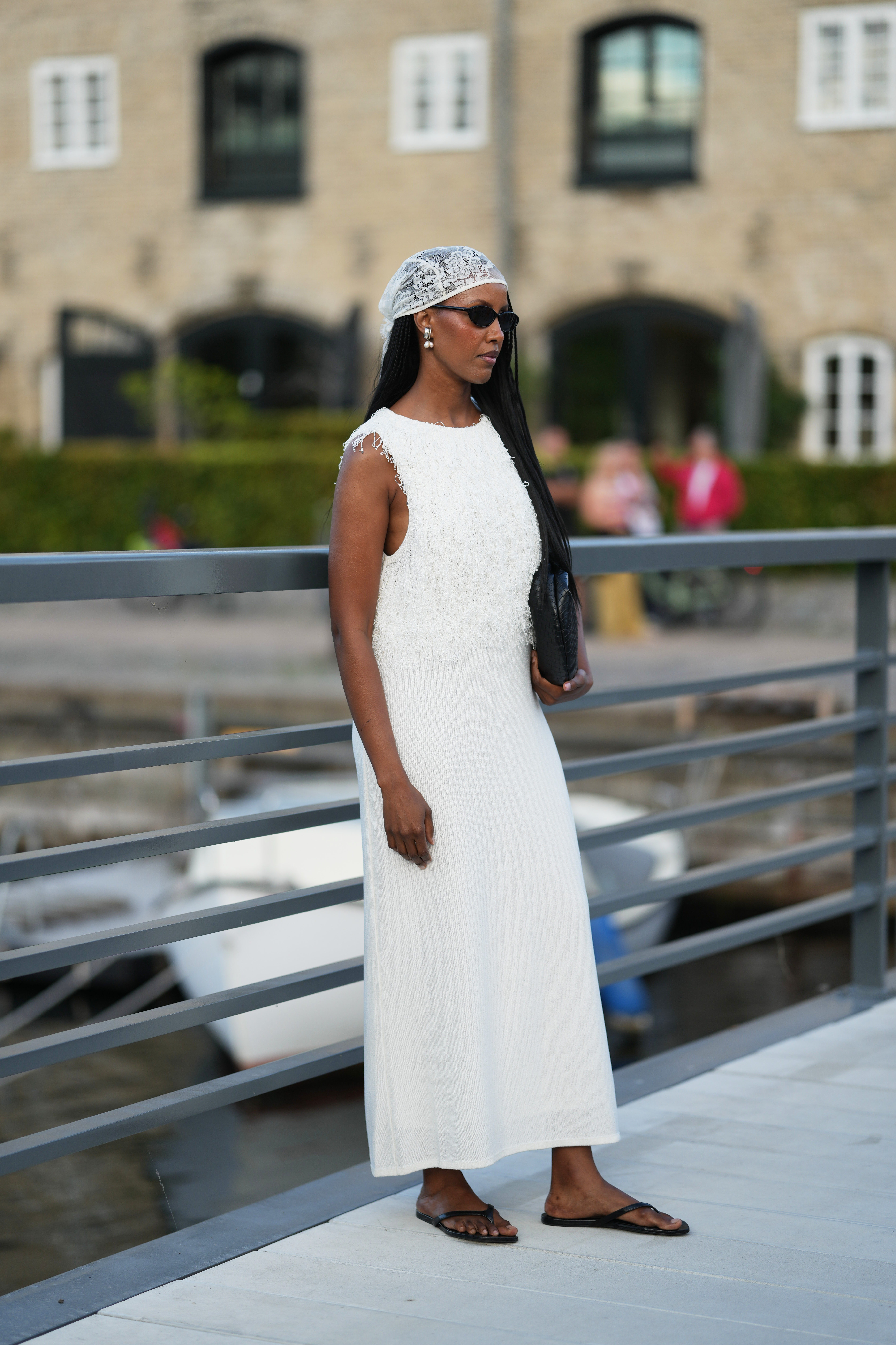 Woman wearing white dress during Copenhagen Fashion Week spring/summer 2027.