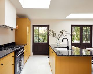 Budget kitchen with yellow painted cabinets