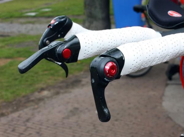 Cofidis time trial bikes were fitted with these carbon fiber-wrapped bar-end shifters from microSHIFT.