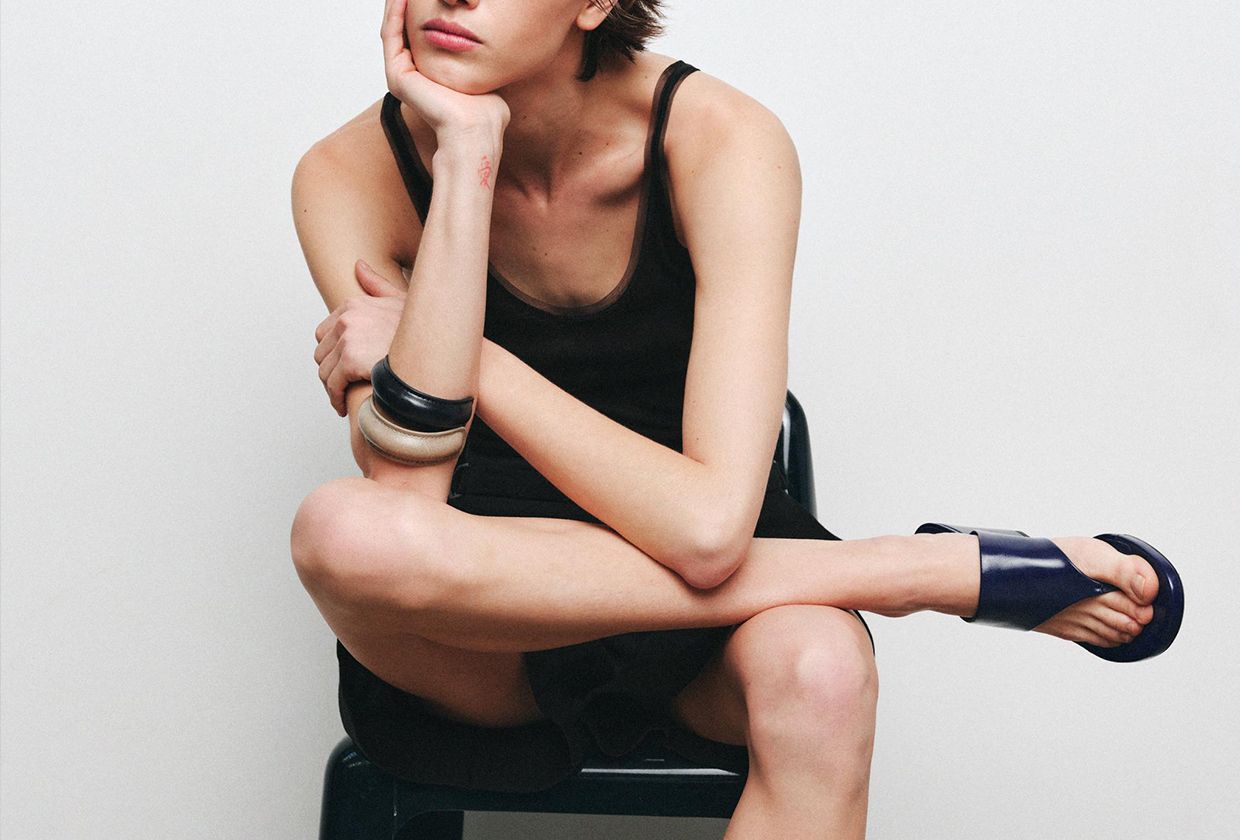 Zara model wearing navy sandals.