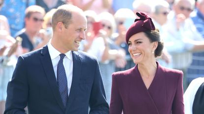 Prince William and Kate Middleton smiling at one another