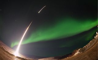 A NASA-funded sounding rocket launches into an aurora in the early morning of March 3, 2014, over Venetie, Alaska. NASA will launch a similar small sounding rocket in late March 2022.