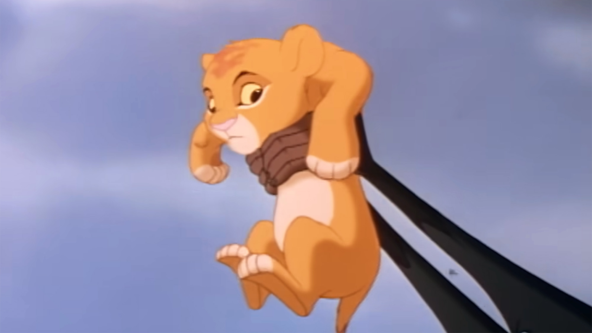 Simba being held in the air on Pride Rock by Rafiki in The Lion King 1994. 