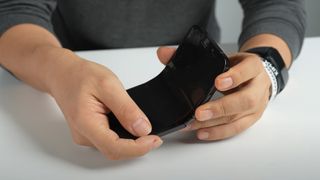 An unofficial foldable iPhone in someone's hand