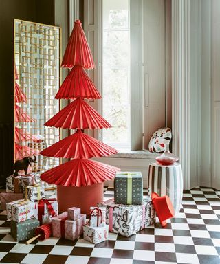 Alternative Christmas tree ideas with a tree shape made from red, partially open parasols