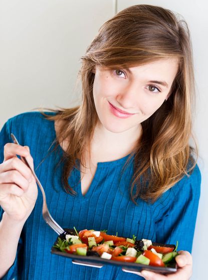 Woman-eating-Salad