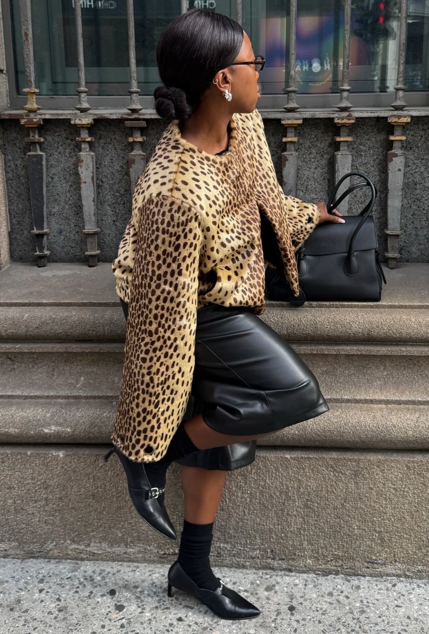 @nnennaechem wears an animal-print jacket