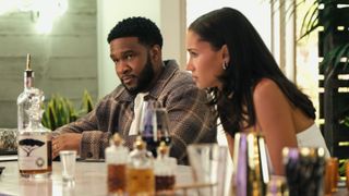 Osy Ikhile as Cassius and Greta Onieogou as Layla Keating at a bar in All American season 7 episode 1