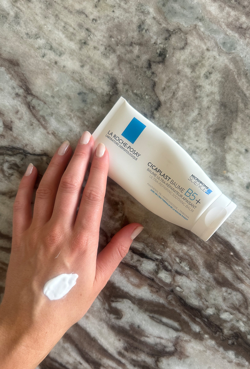 Eleanor swatching the Cicaplast B5 cream on her hand
