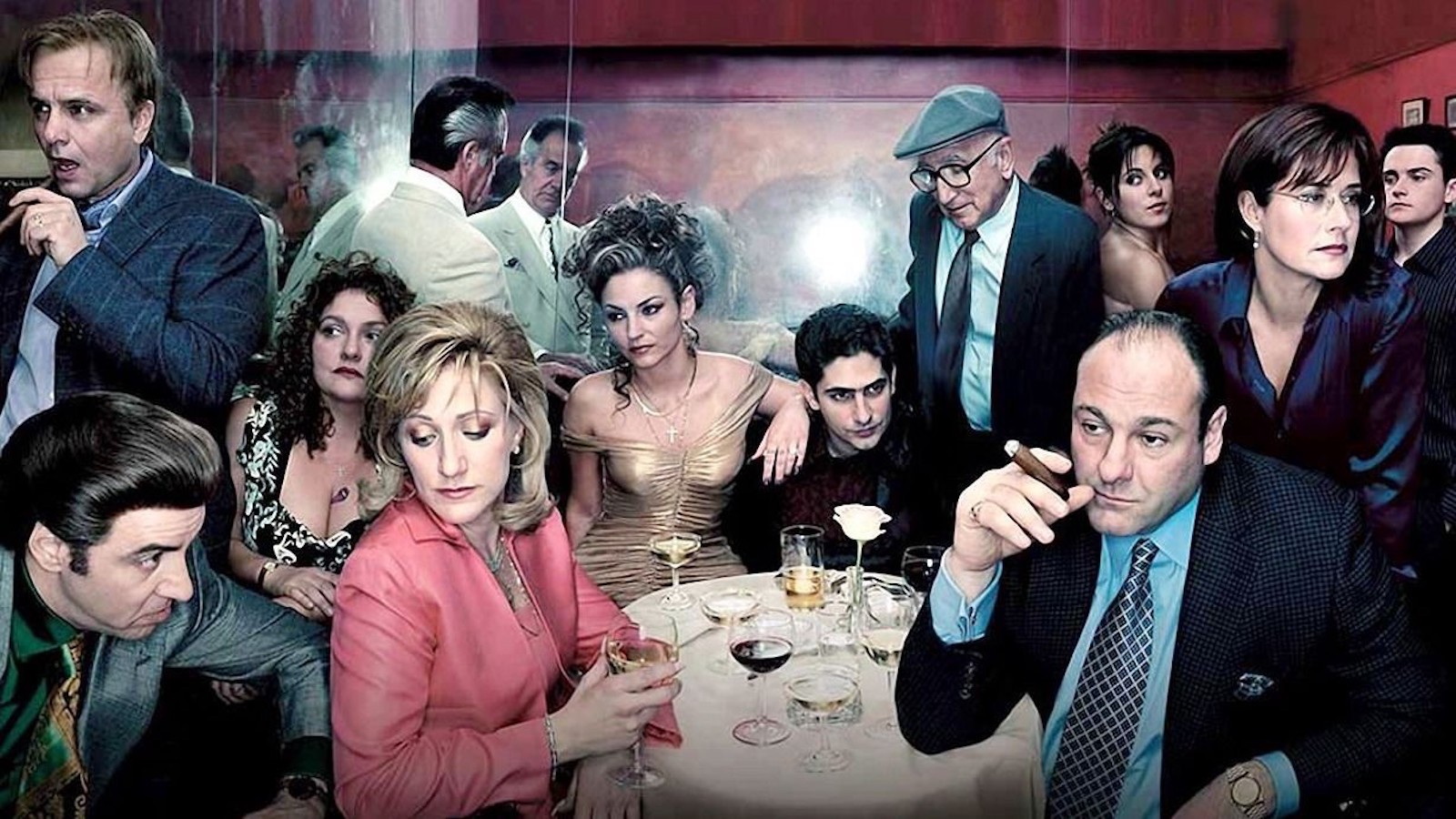 The Sopranos cast posing away from the camera at a restaurant