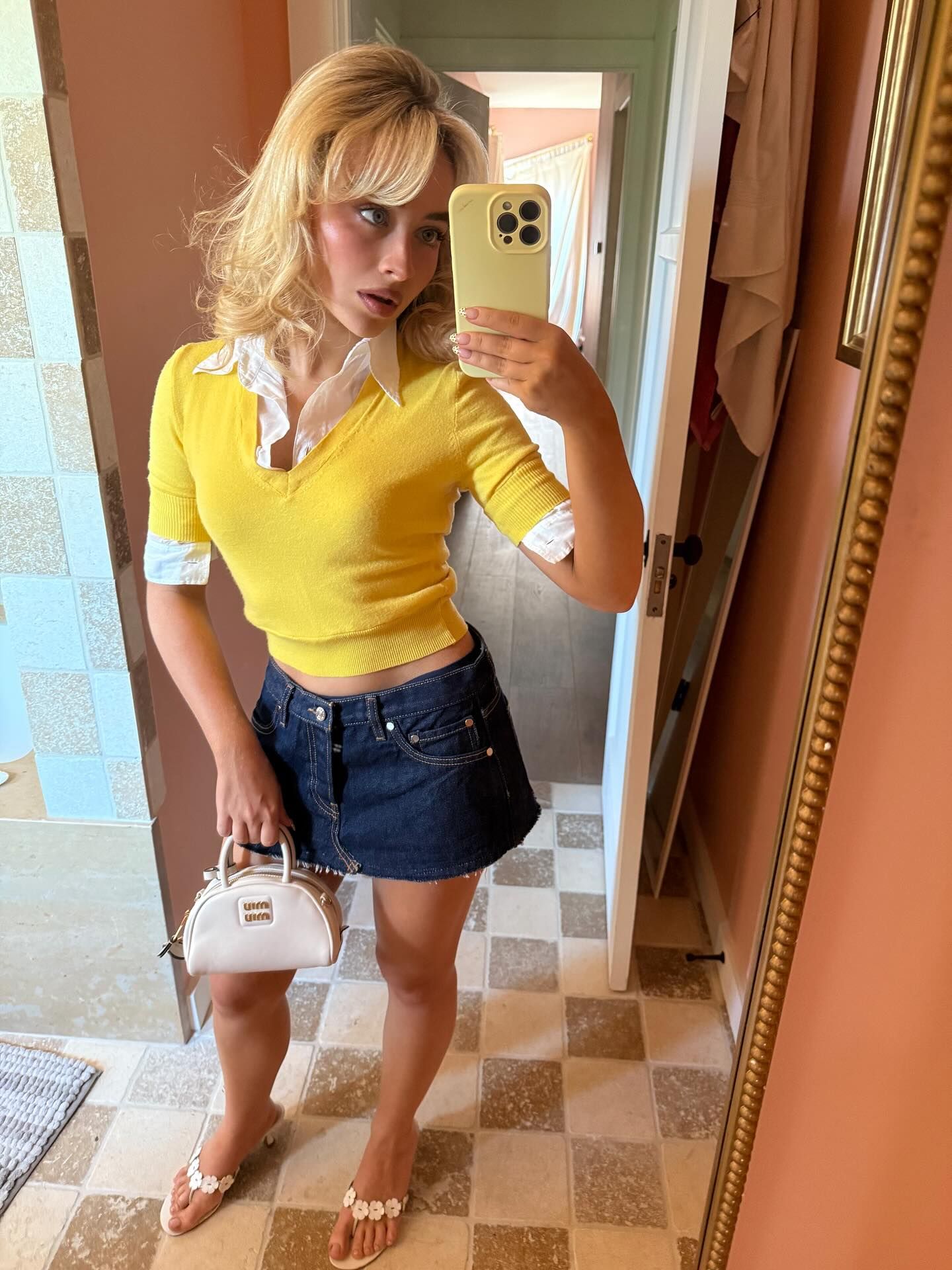 An image of @sabrinacarpenter wearing the Miu Miu Vernice bag, one of the best Miu Miu bags.
