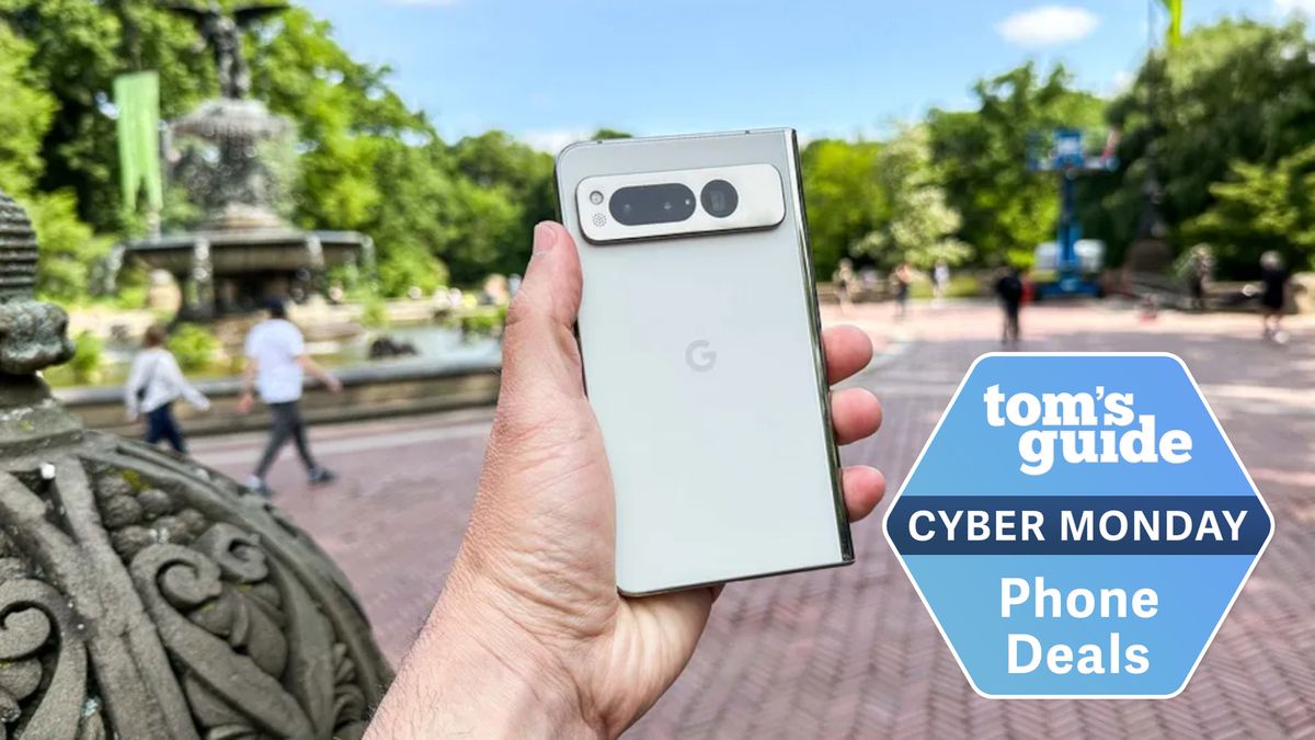 Person holding the Pixel Fold outside near a fountain