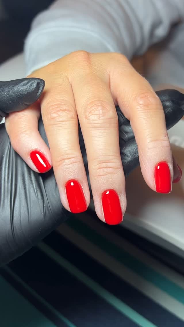 A bright strawberry manicure