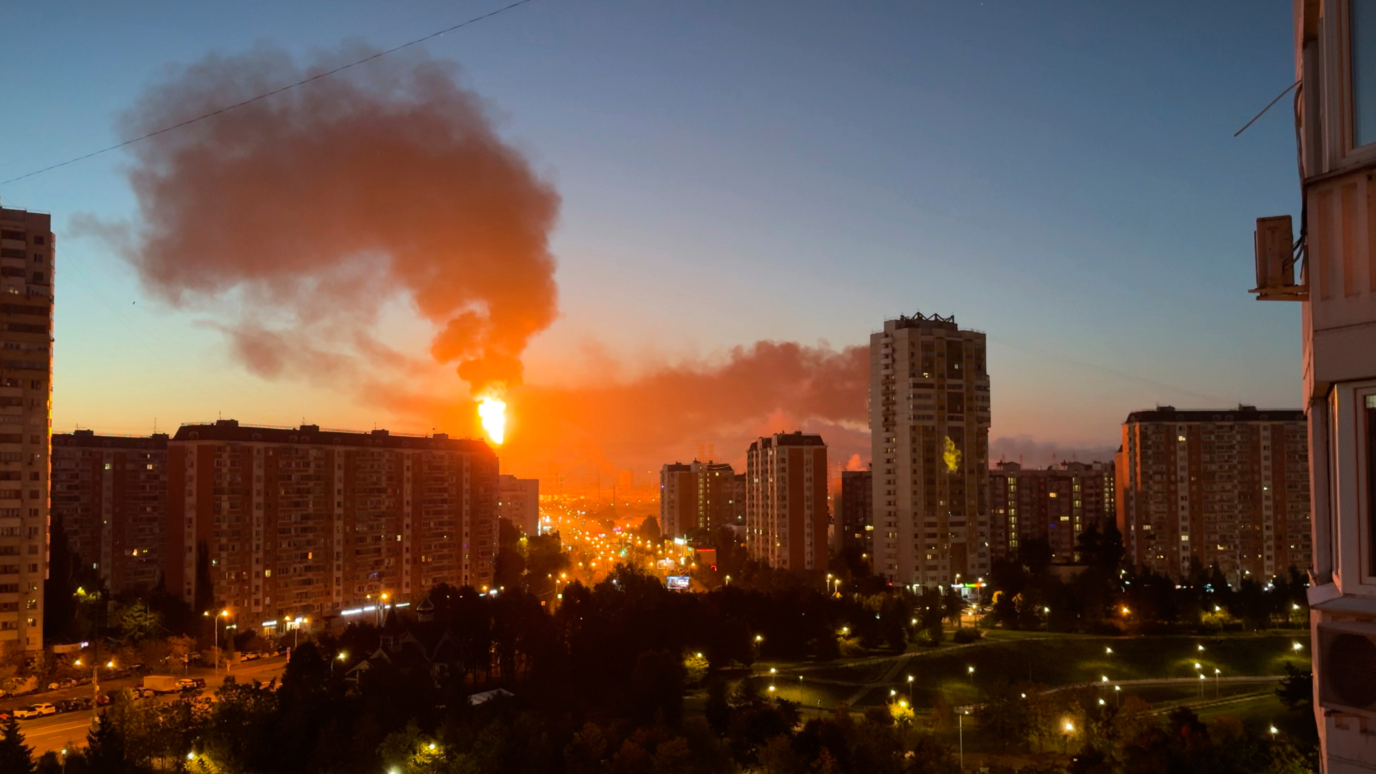 Flame and smoke is seen rising from Moscow's oil refinery in the south east of the city following a largescale Ukrainian drone attack.