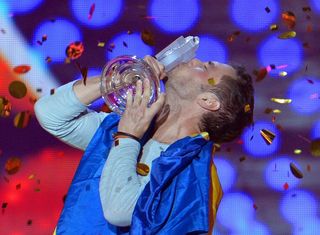 Mans with the 60th Eurovision trophy (Kerstin Joensson/AP)