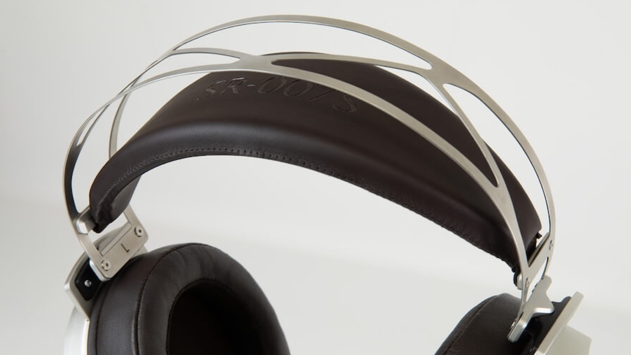 A closeup of the headband on a pair of Stax SR-007s electrostatic headphones
