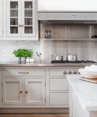 modern wood kitchen with stainless steel kitchen backsplash