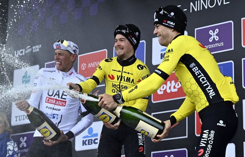 German Nils Politt of UAE Team Emirates, Slovenian Jan Tratnik of Team Visma-Lease a Bike and Belgian Wout van Aert of Team Visma-Lease a Bike celebrate on the podium of the 79th edition of the men&#039;s one-day cycling race Omloop Het Nieuwsblad (UCI World Tour), 202km from Gent to Ninove, Saturday 24 February 2024.
BELGA PHOTO DIRK WAEM (Photo by DIRK WAEM / BELGA MAG / Belga via AFP)