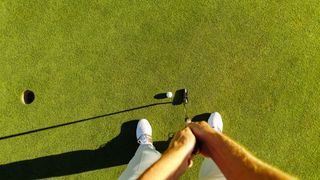 a photo of a man putting on a green