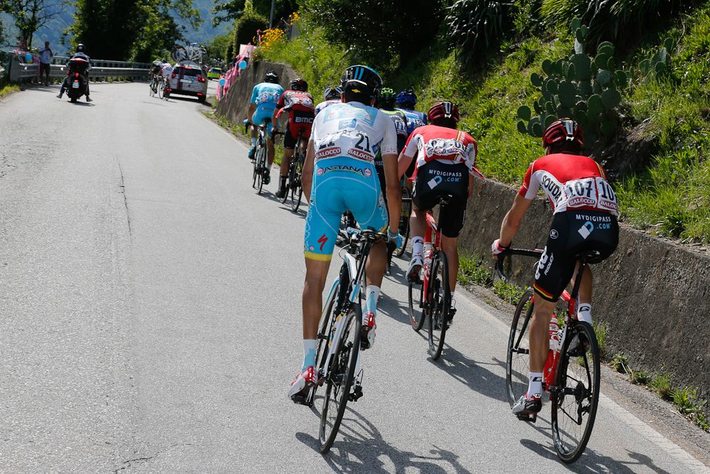 The leaders ride away from Fabio Aru during stage 18.