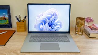 Surface Laptop 5 open on desk showing Windows 11 desktop