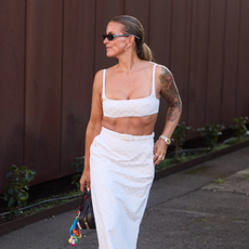 woman wearing white bandeau top and a pencil skirt in Copenhagen