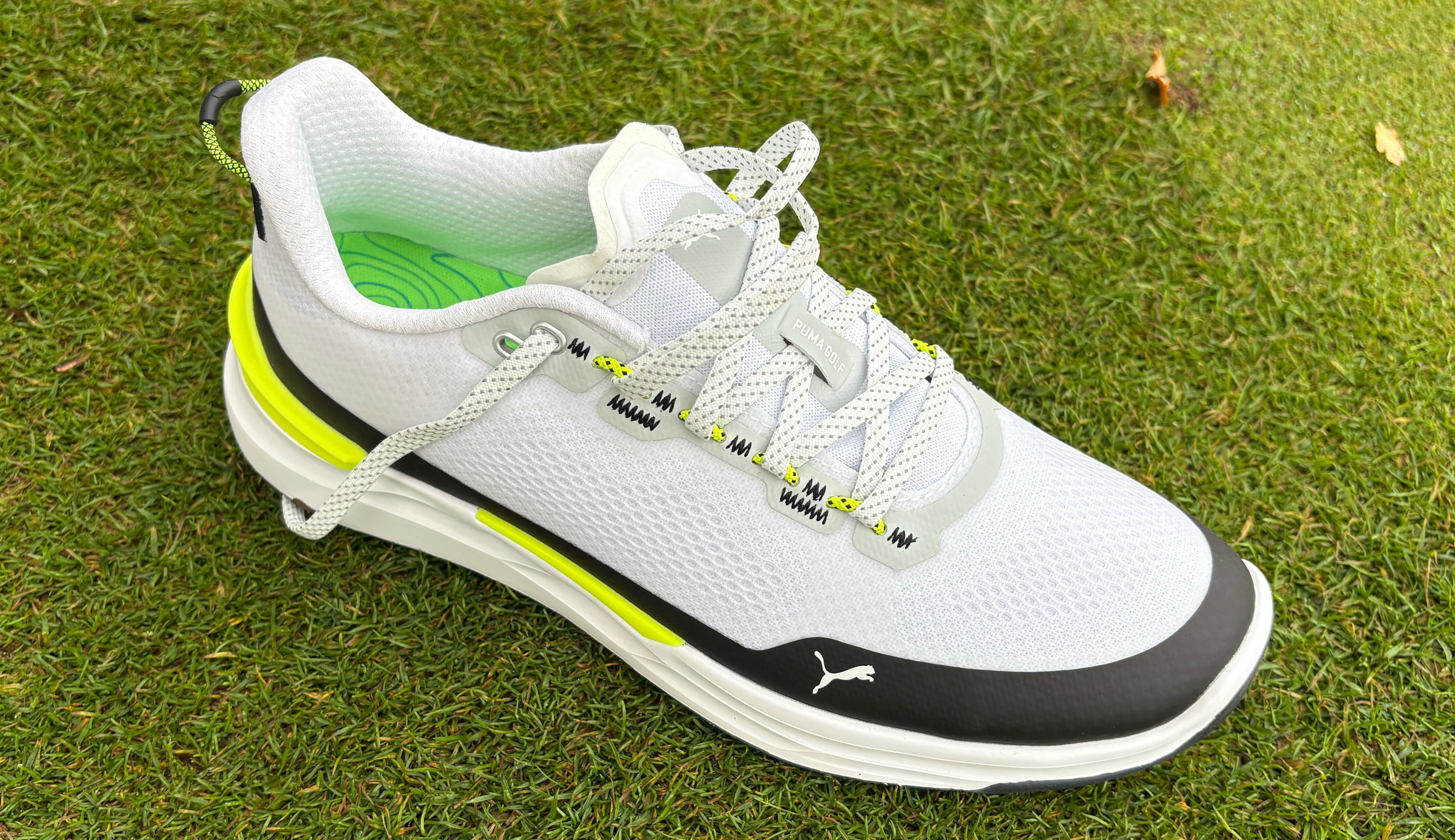A close up of the Puma Ignite Elevate X Golf Shoe on grass