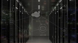 Cloud symbol overlaying servers in a data center - colocation services