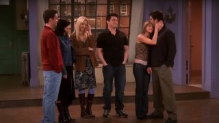 The Friends cast emotionally stand together in an empty apartment in the series finale.