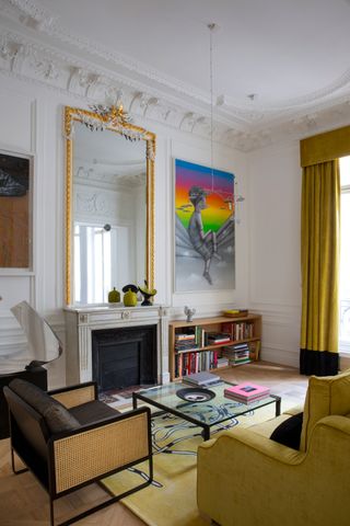 a living room with yellow curtains