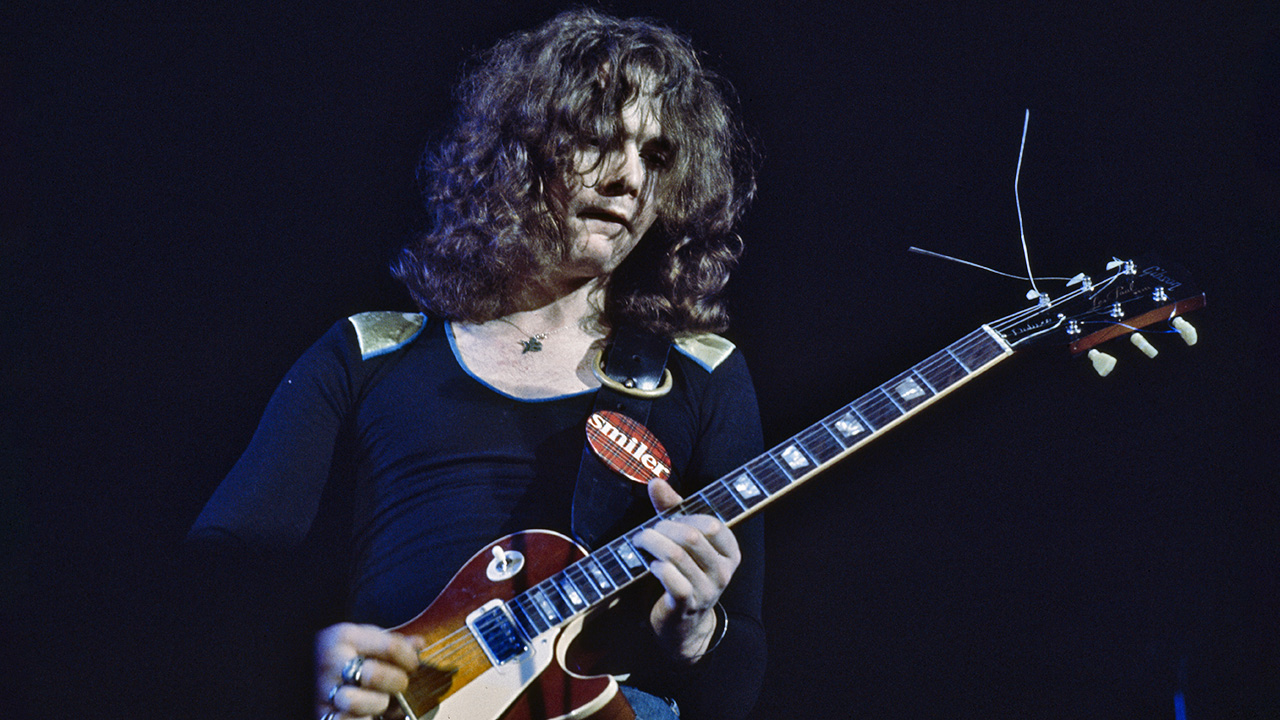 Brian Robertson of Thin lizzy performs on stage in 1977