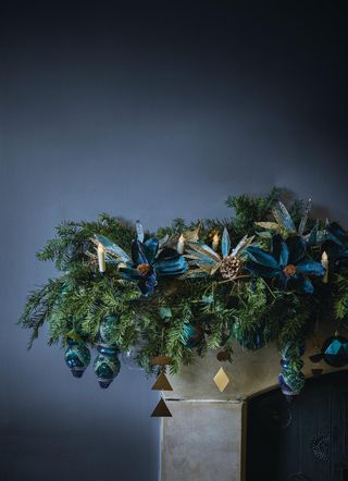 foliage garland with blue decorations and lights