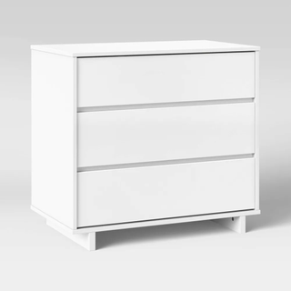 A white wooden 3-drawer dresser