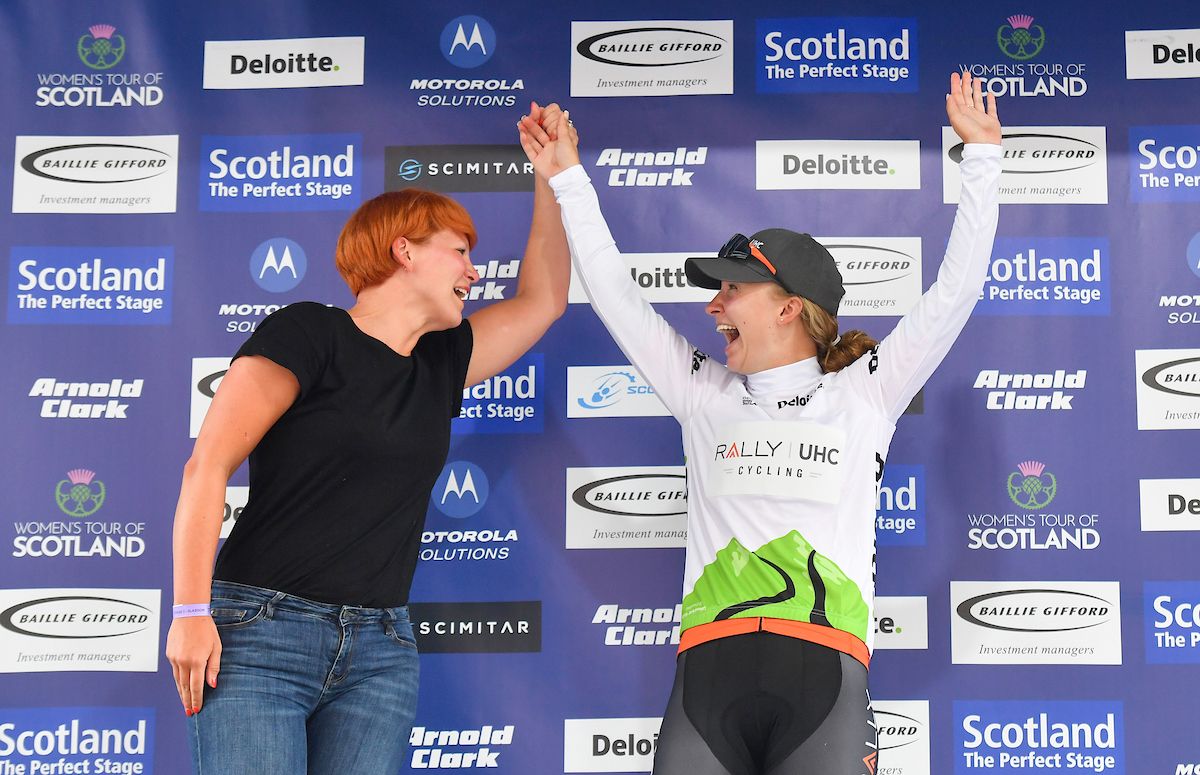 Emma White of RALLY UHC cycling team on the podium in the Deloitte Best Young Rider Jersey.