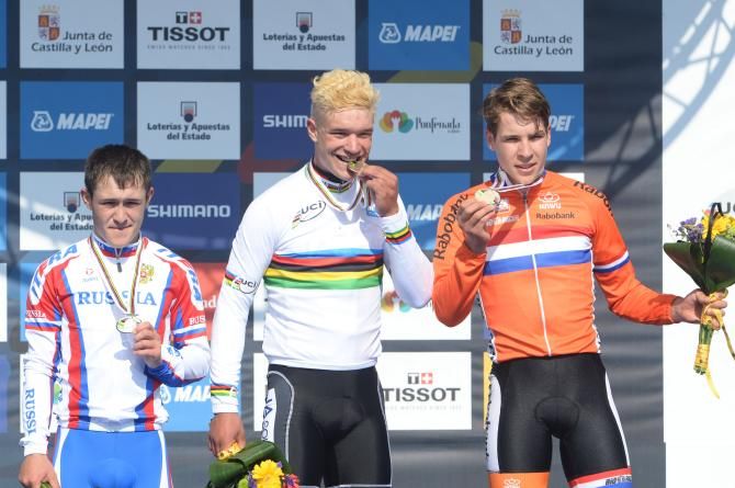 The riders taste their gold, silver and bronze medals