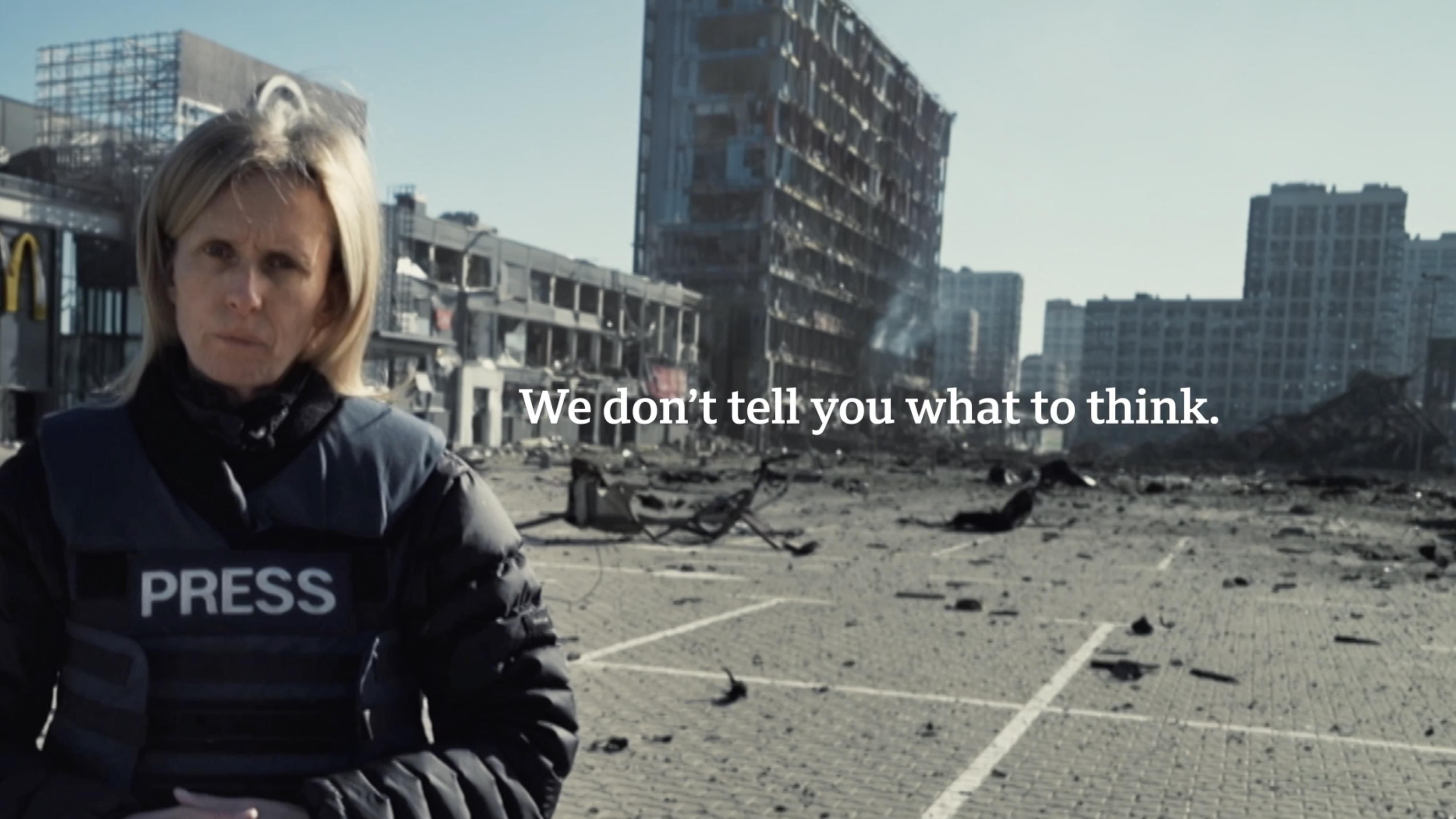 woman in a press vest with text 'we don't tell you what to think'