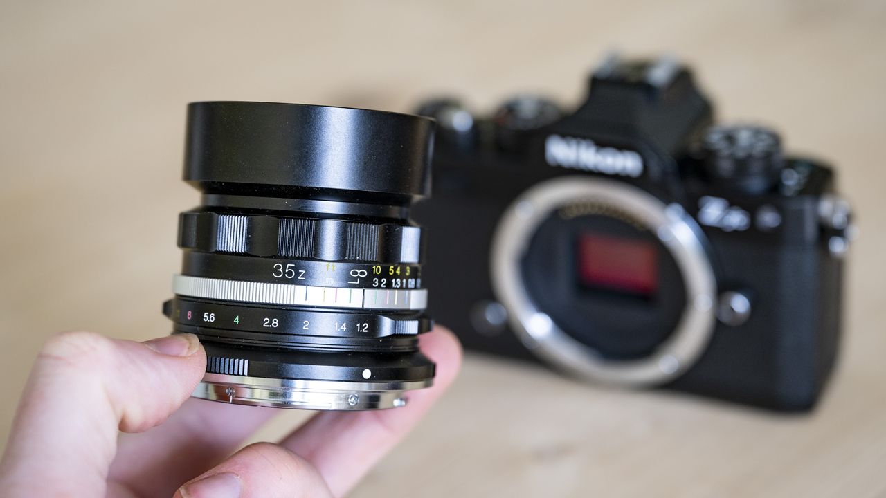 Voigtlander D 35mm f1.2 Nokton lens on a wooden table
